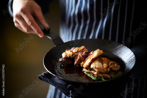 Grilled chicken on frying pan 