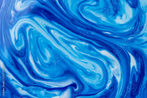 Blue liquid ink swirl abstract background
