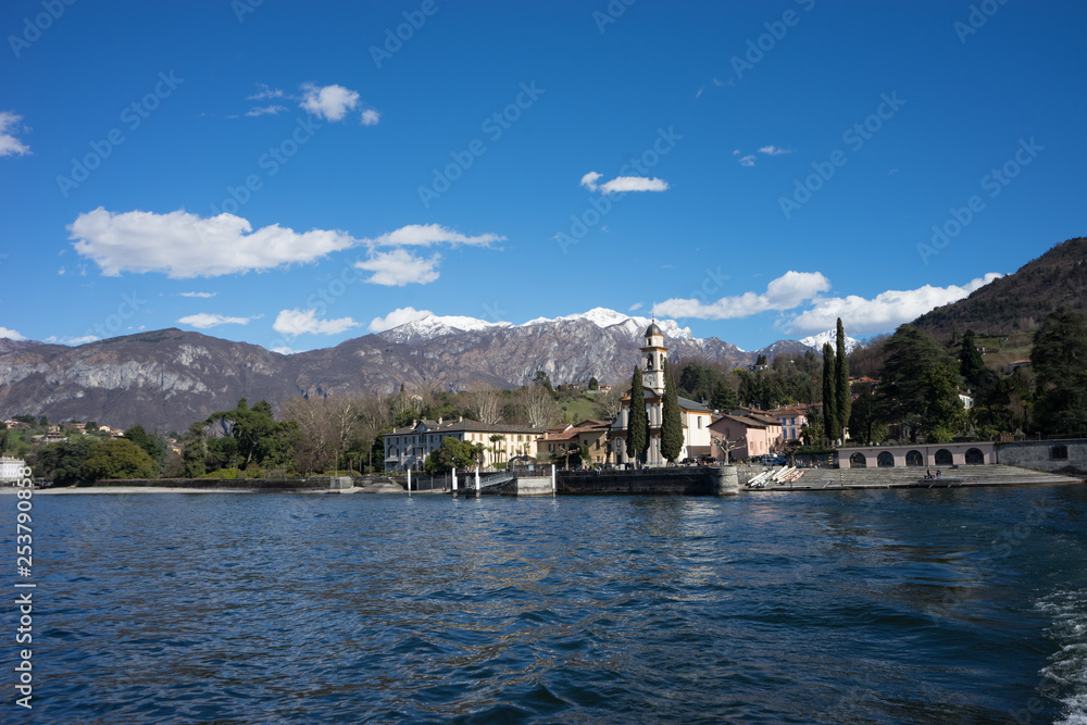 Italy, Lecco, church beside Lake Como with a mountain in the background