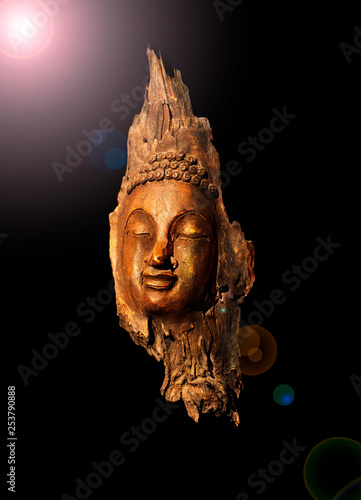 Head Buddha statue made of wooden black background