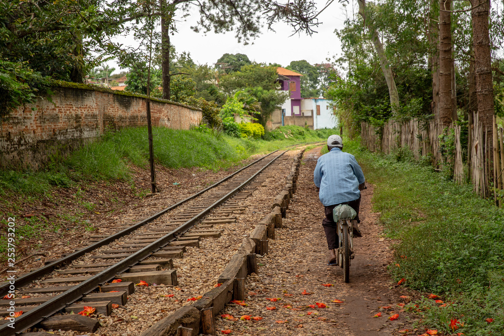 Fototapeta premium man on railroad tracks