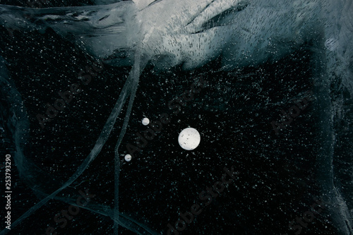 A drop of methane on the black ice of Baikal