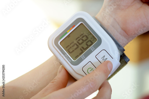 Patient with sphygmomanometer has too high blood pressure photo