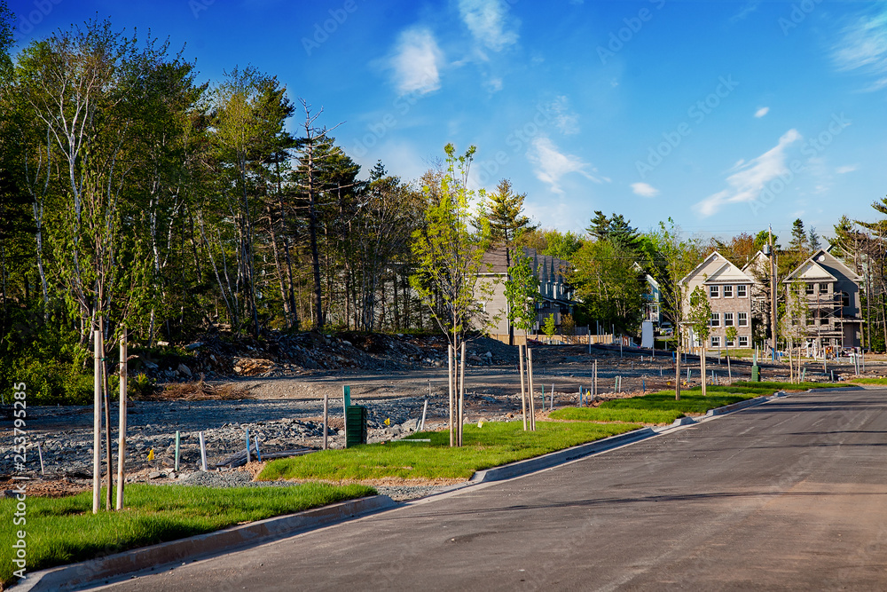 Road construction in an expanding suburban neighborhood.