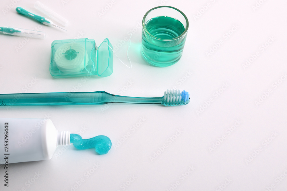 Equipment for oral hygiene on a white table elevated view Equipment for oral hygiene on a white table elevated view