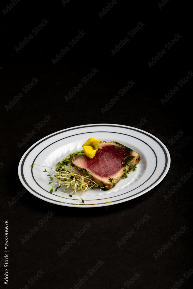 Tuna appetizer on black background Tuna appetizer on black background