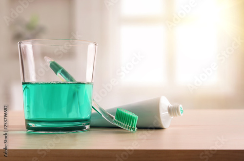 Concept oral hygiene on wood table in bathroom at home