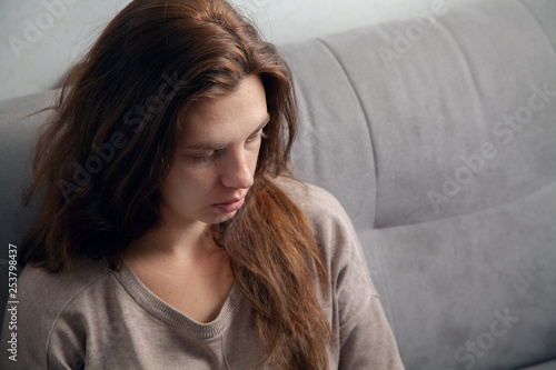Portrait of a young woman. Emotions of sadness and depression.