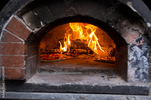 Pizzas in firebrick oven