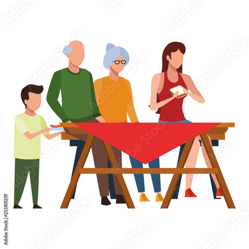 faceless family eating outdoor table