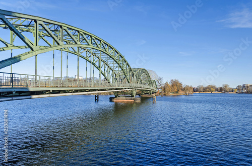 Arch bridge Eiswerderbruecke over the river Havel in Berlin, Germany photo