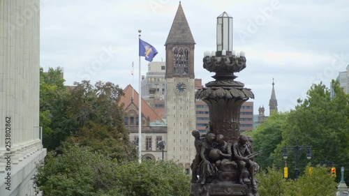 Bronze Statue of Children and Building Tops in Albany New York photo