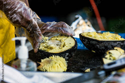 Roasted breadfruit being prepared, a Barbadian delicacy, a Caribbean delicacy photo