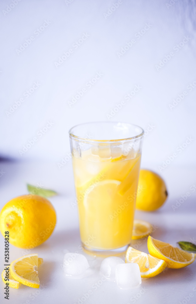 Fototapeta premium Lemonade. Drink with fresh lemons. Lemon cocktail with juice and ice.