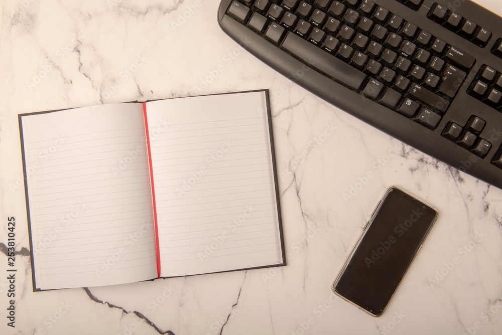 notebook and keyboard on table notebook and keyboard on table