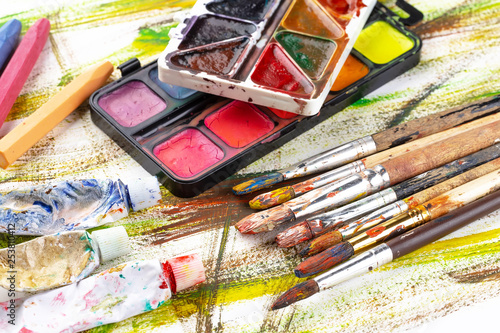 Paint brushes and paints for drawing.