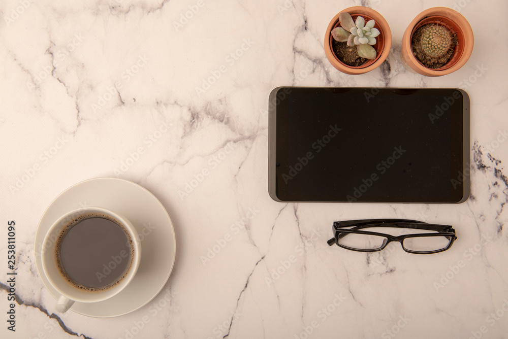 Tidy office desk with tablet and coffee Tidy office desk with tablet and coffee