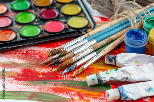 Paint brushes and paints for drawing.