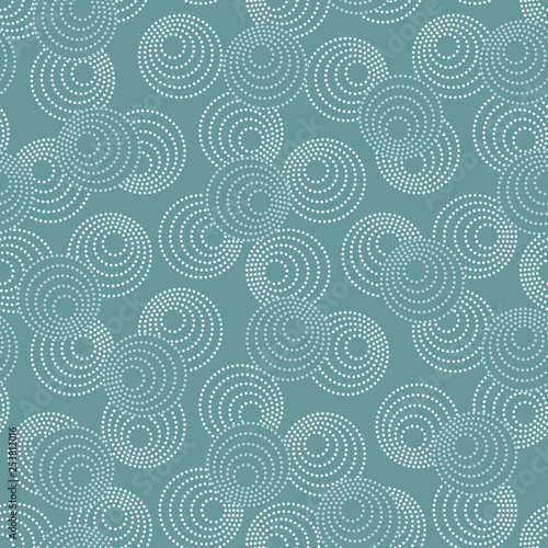 Concentric circles with dotted outline in two colors. Seamless geometric pattern on gray-blue background. Vector image