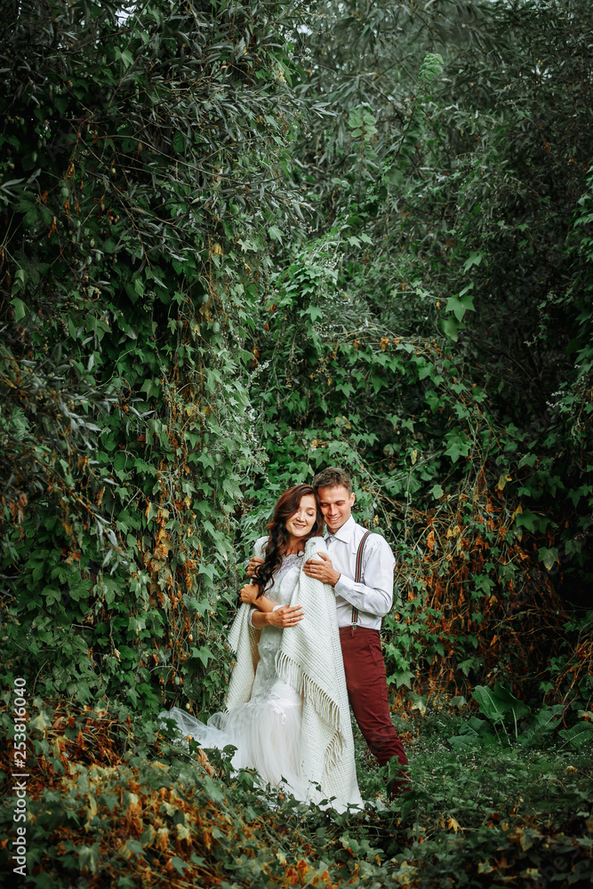couple in love, the bride and groom in the fairy forest couple in love, the bride and groom in the fairy forest