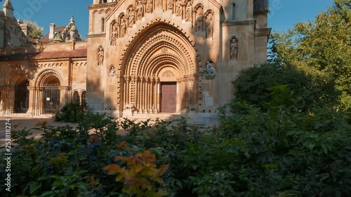 Establishing shot of the Jaki Chapel in Vajdahunyad Castle in Budapest, Hungary on a beautiful sunny day photo