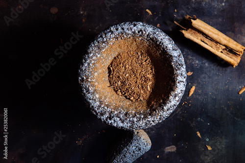 Fresh ground cinnamon in a mortar and pestle