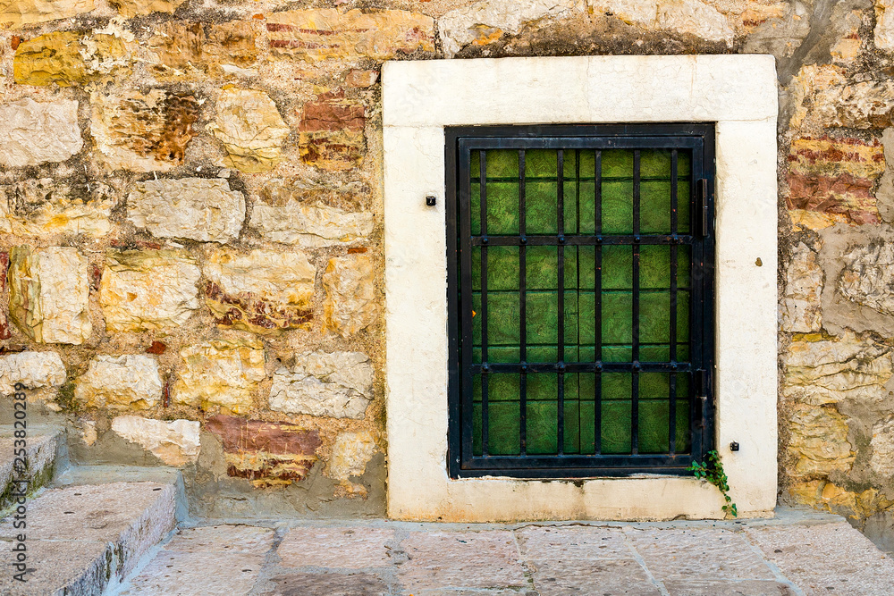 Authentic, stone wall, with beautiful, old, wooden shutters and window, minimal style, bright colors, background.