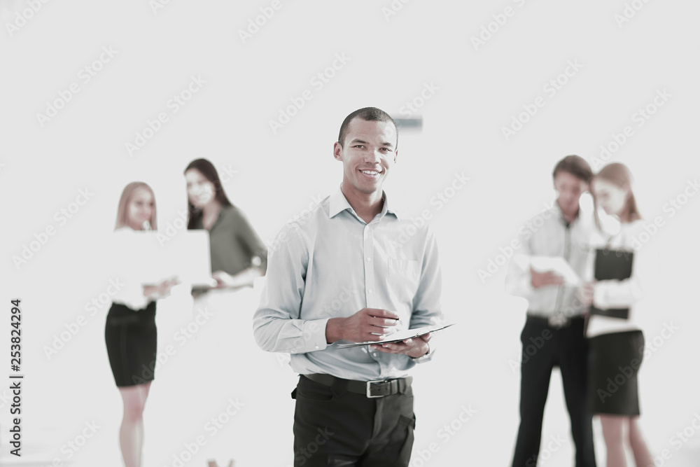employees of the company before the meeting, standing in the lobby of the office employees of the company before the meeting, standing in the lobby of the office
