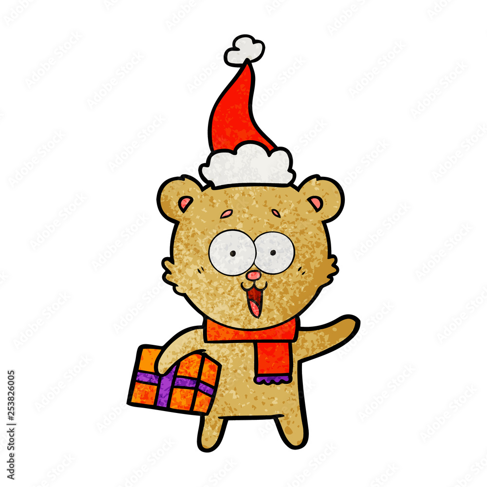 laughing teddy bear with christmas present wearing santa hat laughing teddy bear with christmas present wearing santa hat