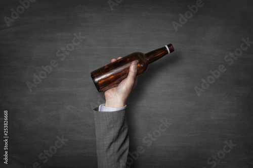 Photos Businessman holding beer bottle