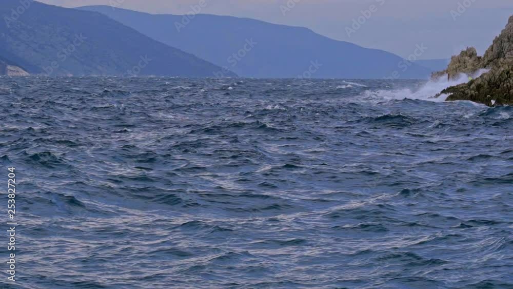 Gorgeous seascape of the agitated waves in Brestova coast on a cloudy day. Croatia. Flat plane. Slow motion Gorgeous seascape of the agitated waves in Brestova coast on a cloudy day. Croatia. Flat plane. Slow motion