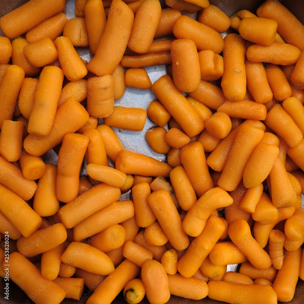 Photo vegetables, boiled carrots on a plate. Whole boiled carrots Photo vegetables, boiled carrots on a plate. Whole boiled carrots