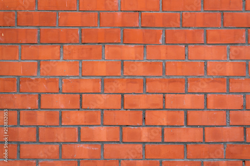 Wall of red facing brick background.