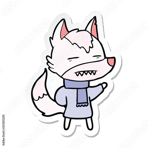 sticker of a cartoon wolf in winter clothes © lineartestpilot
