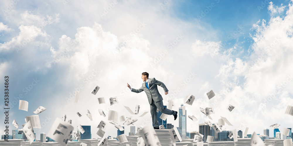 Precise businessman in suit running with phone. Precise businessman in suit running with phone.
