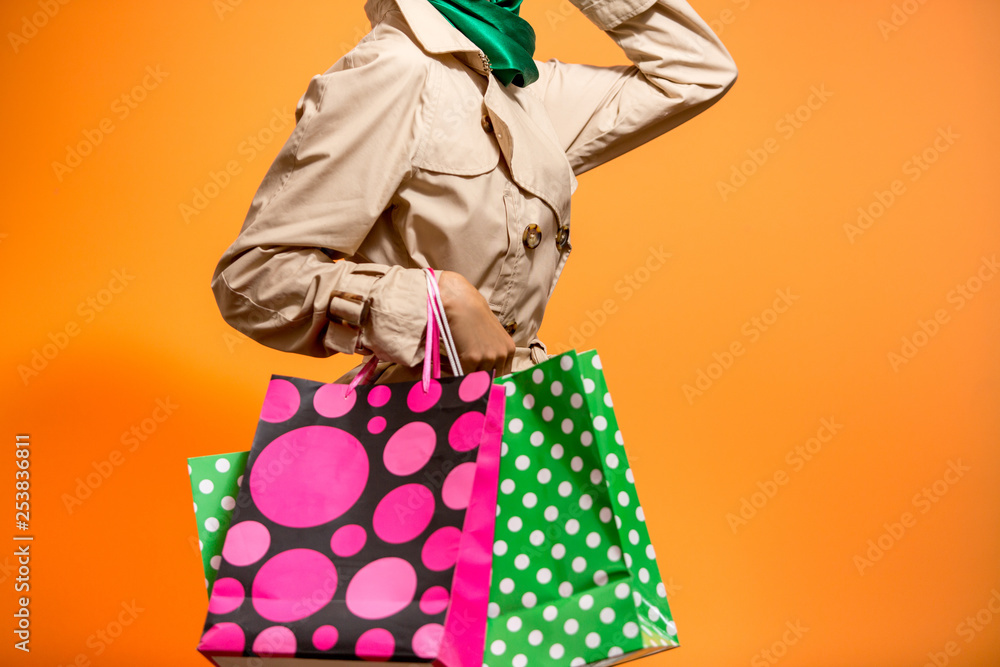 Spring or autumn shopping woman holding shopping bags