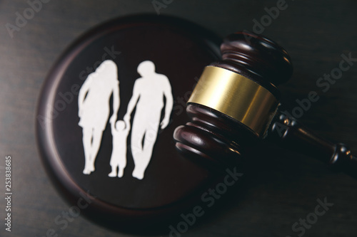 Family figure and gavel on table. Family law concept