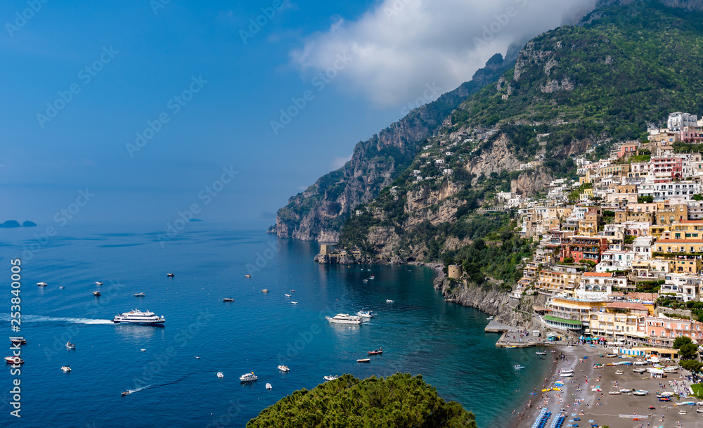 Panoramic view of beach and colorful buildings  in Positano town  at  Amalfi Coast, Italy.