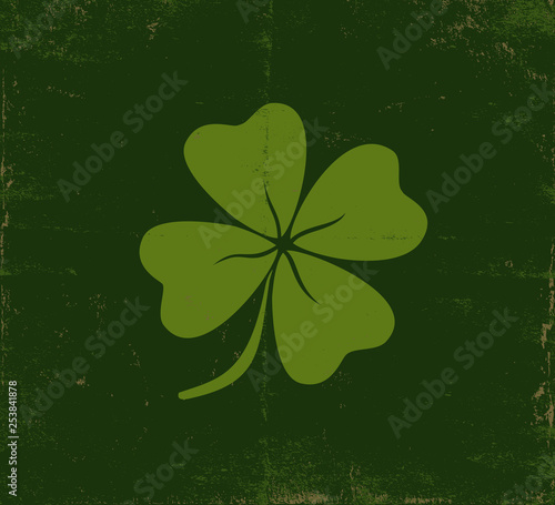 Lucky clover on old dark green paper