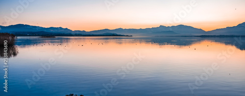 Gorgeous sunrise on the shores of the Upper Zurich Lake (Obersee) between the village of Hurden (Seedam, Schwyz) and Rapperswil (Sankt Gallen), Switzerland photo