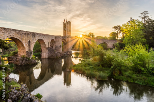 Golden sunrise at the medieval bridge of Besalu, in Spain (Catalonia).