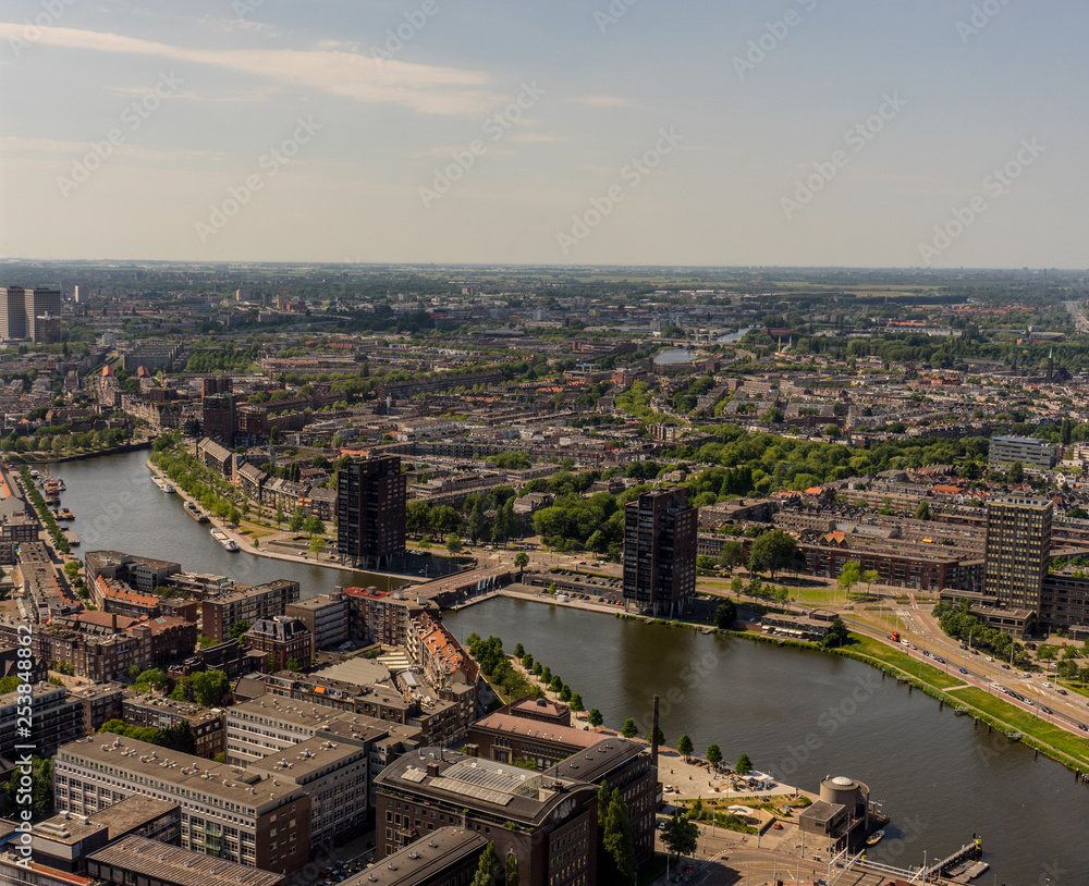 Netherlands, Rotterdam, a view of a city next to a body of water
