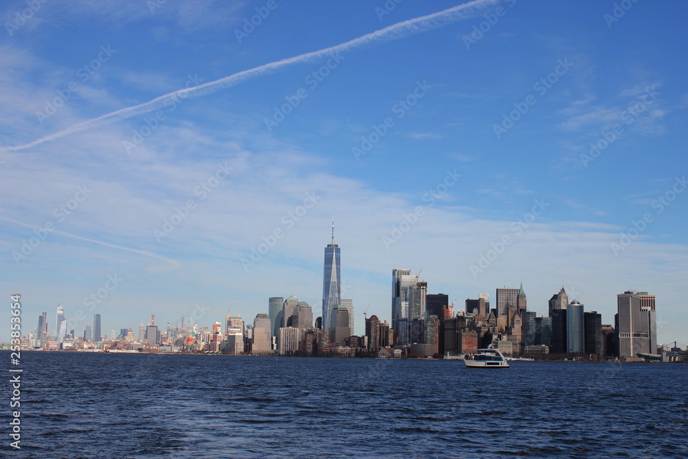 Fototapeta premium Wide Cityscape of manhattan as seen from liberty island