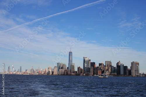 Wide Cityscape of manhattan as seen from liberty island