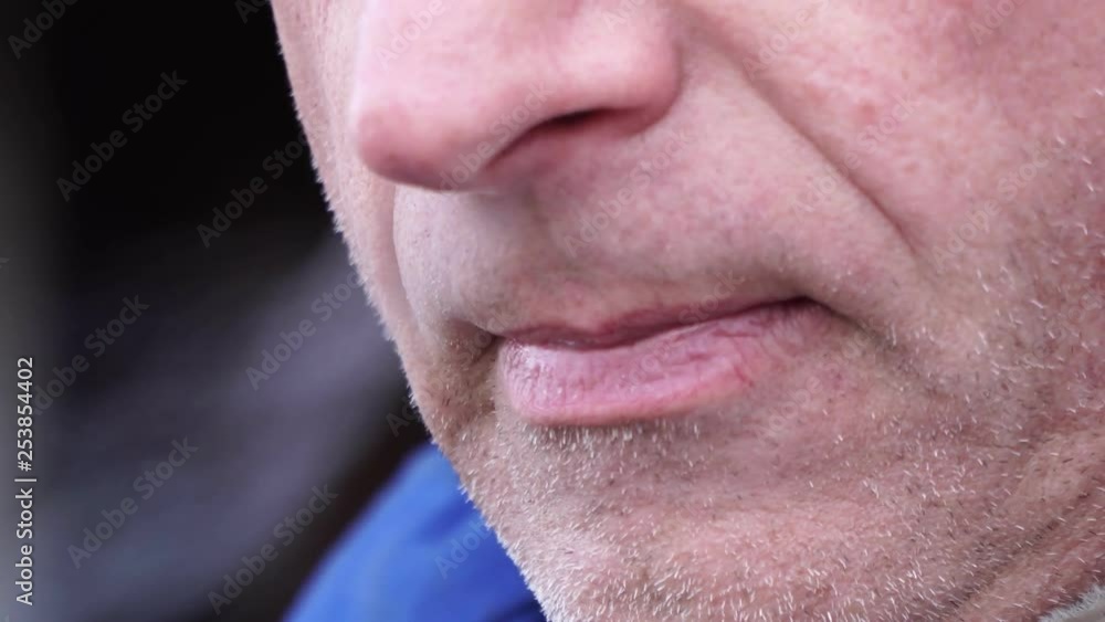 Man smoking a cigarette close up Man smoking a cigarette close up