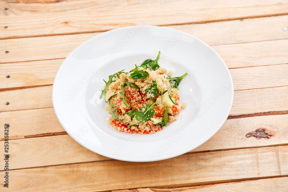 An easy, zesty summer salad with a Mediterranean flair featuring Israeli couscous and chopped summer vegetables An easy, zesty summer salad with a Mediterranean flair featuring Israeli couscous and chopped summer vegetables