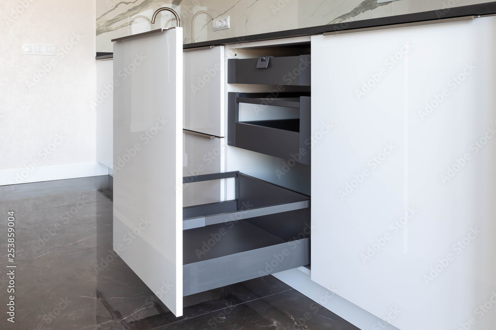 Opened kitchen drawer with high front and inner drawers inside Opened kitchen drawer with high front and inner drawers inside