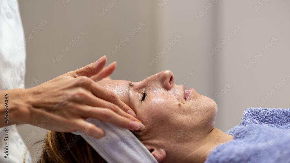 Profile view of young woman on massage table
