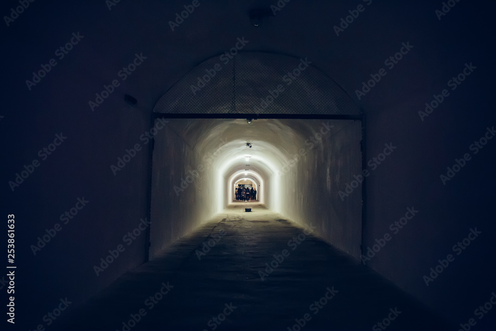 Long corridor or illuminated tunnel in bomb shelter, underground military bunker of cold war, perspective