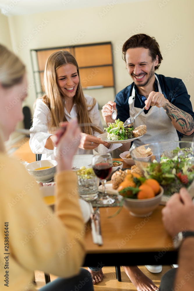 Friends having fun, eating lunch together Friends having fun, eating lunch together